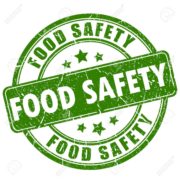 green and white food safety sign