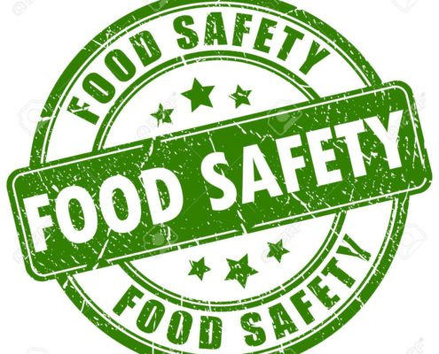 green and white food safety sign